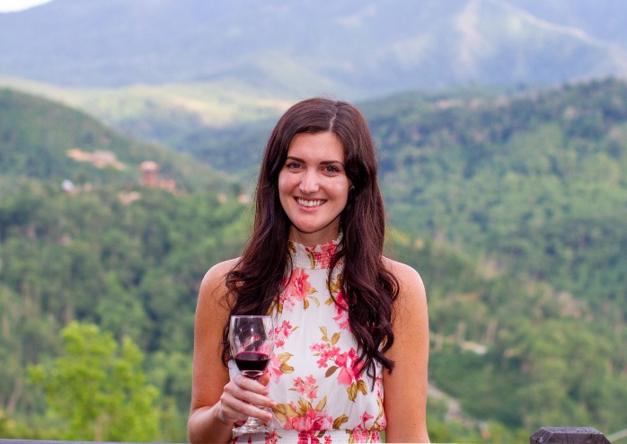 Christina holding a wine glass